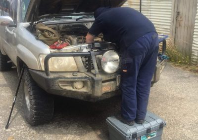 car mechanic fixing car