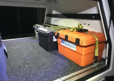 storage boxes inside a camping vehicle