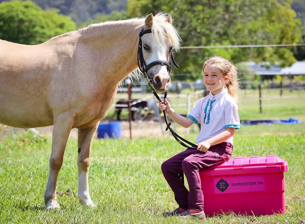 Equestrian Kid sitting on Expedition134 box
