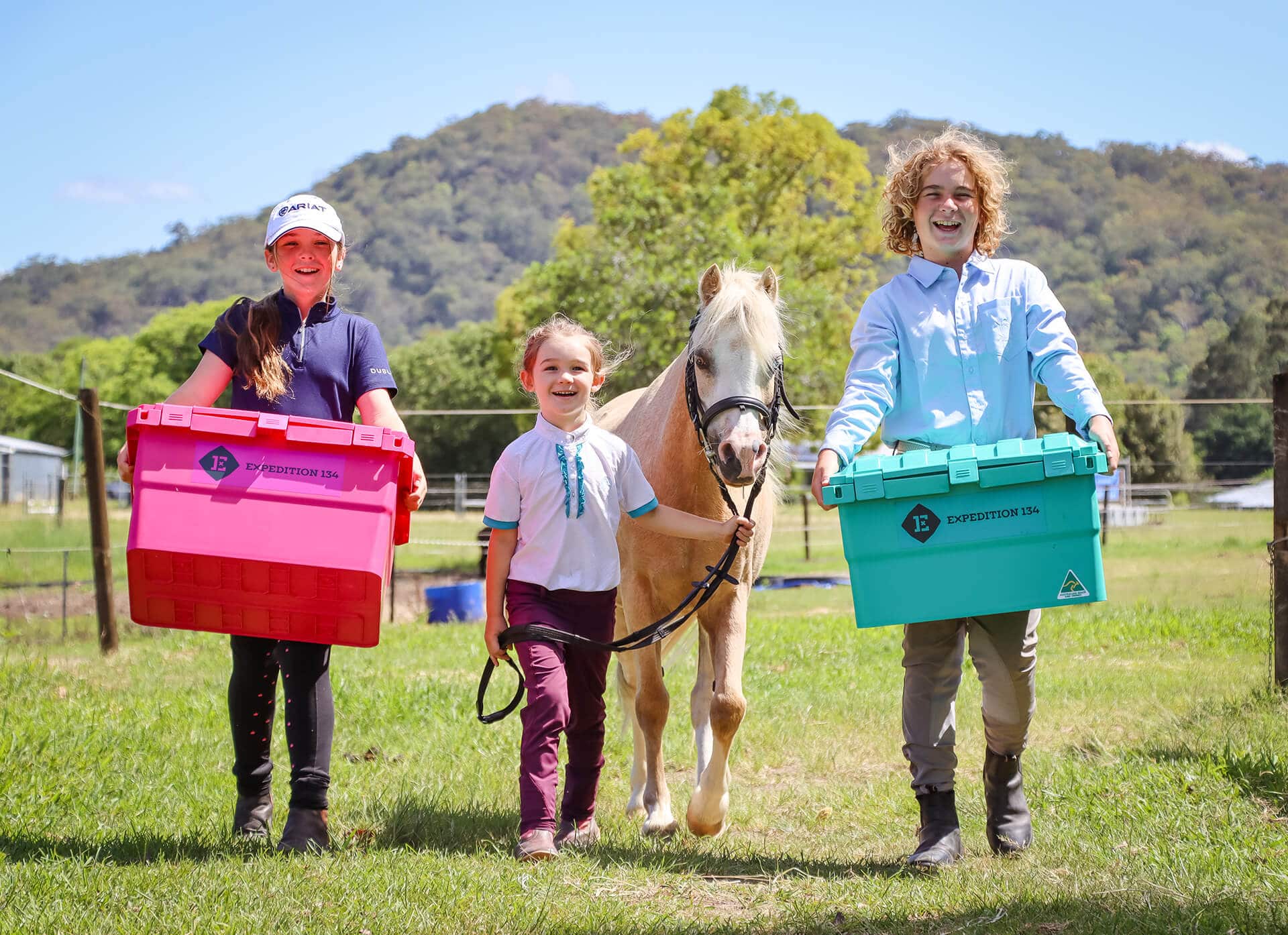 Equestrian Kids holding a horse tuck box